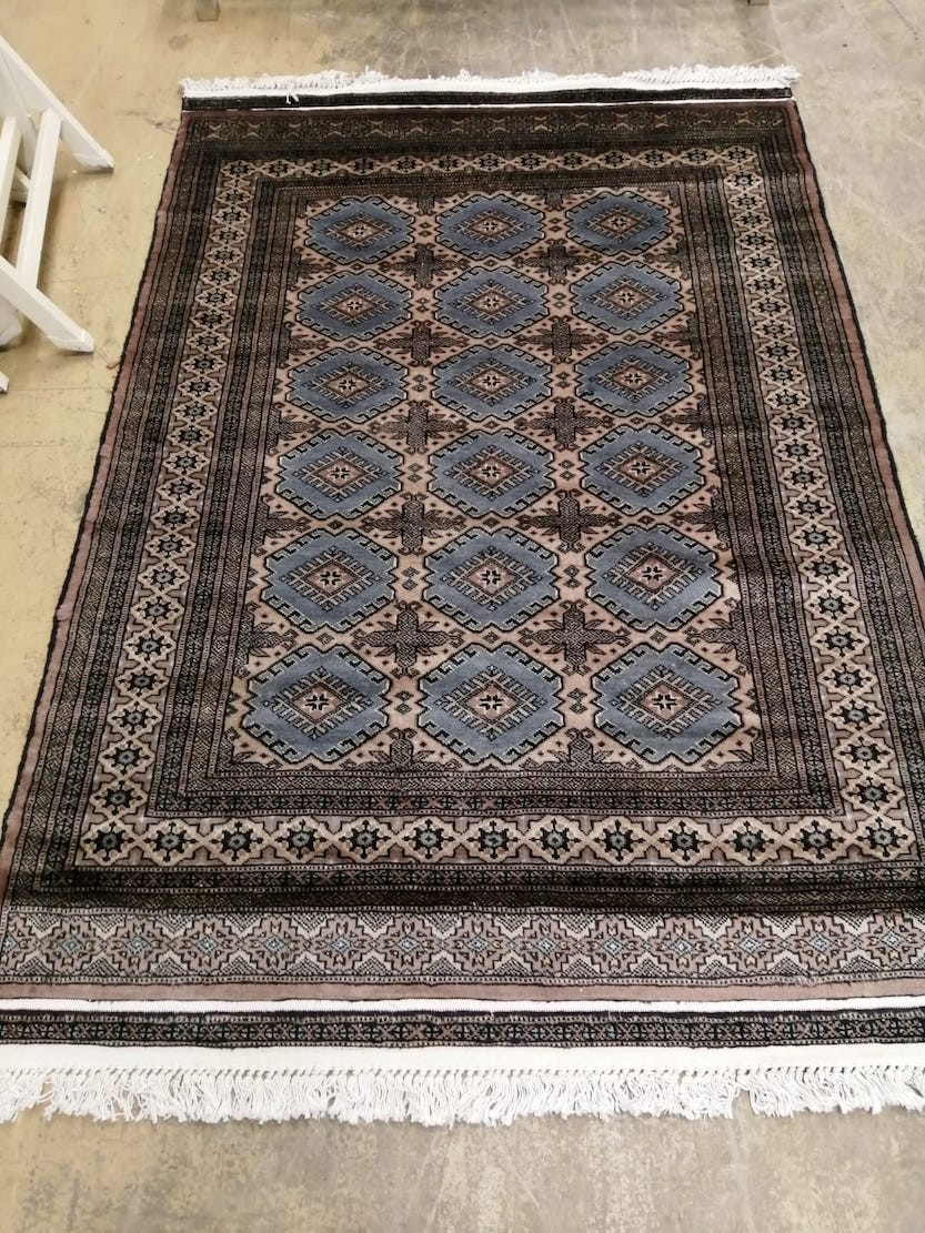 A Karachi blue-brown rug, 180 x 125cm